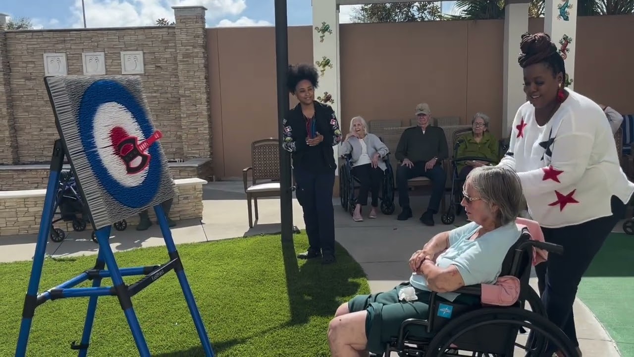 Throwing Axes for Fun in the Courtyard | Transitional Memory Care at Chateau Madeleine, Melbourne FL