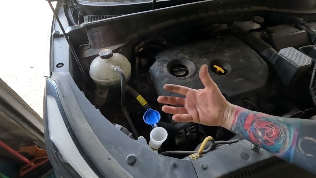 2018 Hyundai Tucson, Refill the windshield washer fluid reservoir (Low Washer Fluid)