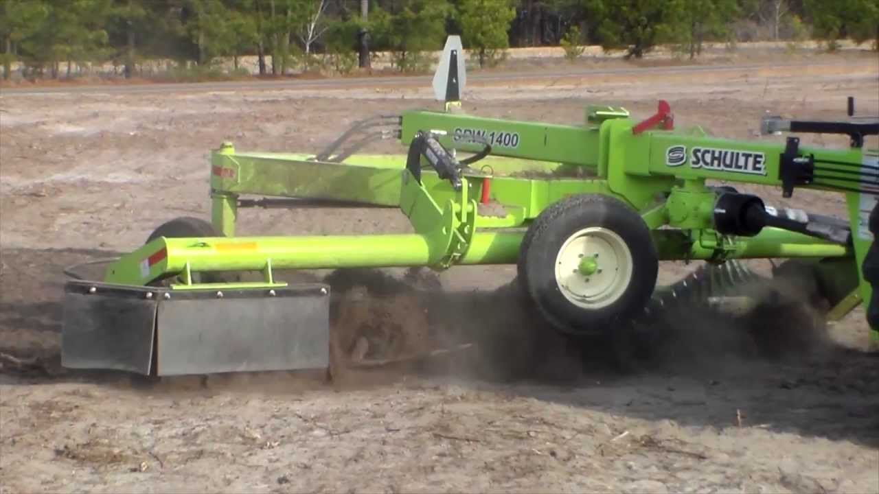 Easy way to pickup roots, stumps and chunks with a Schulte SRW1400 Windrower & RS320 Rock Picker