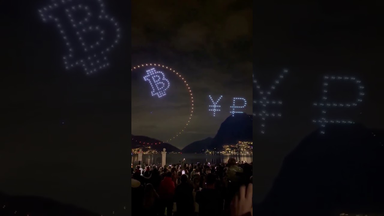 Bitcoin pac man devorando as moedas Fiat durante a confer&ecirc;ncia sobre Bitcoin em Lugano, Su&iacute;&ccedil;a.
