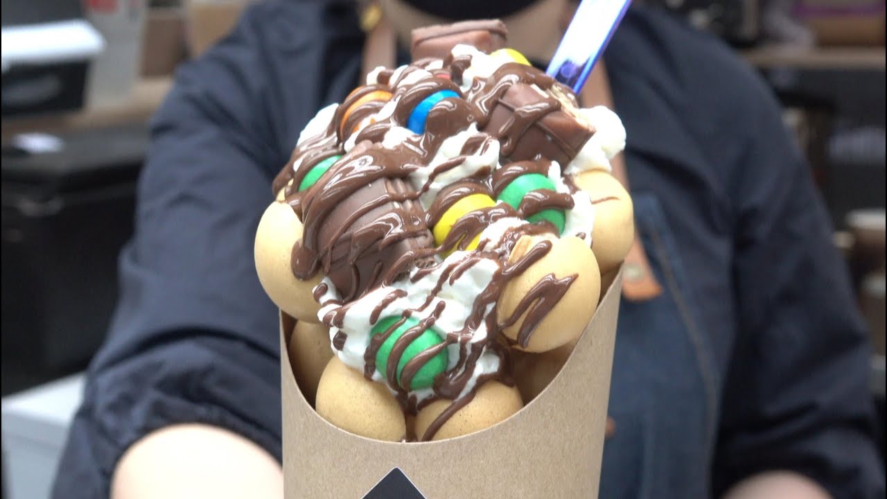 Bubble Waffle Loaded with Sweets and Cream. London Street Food