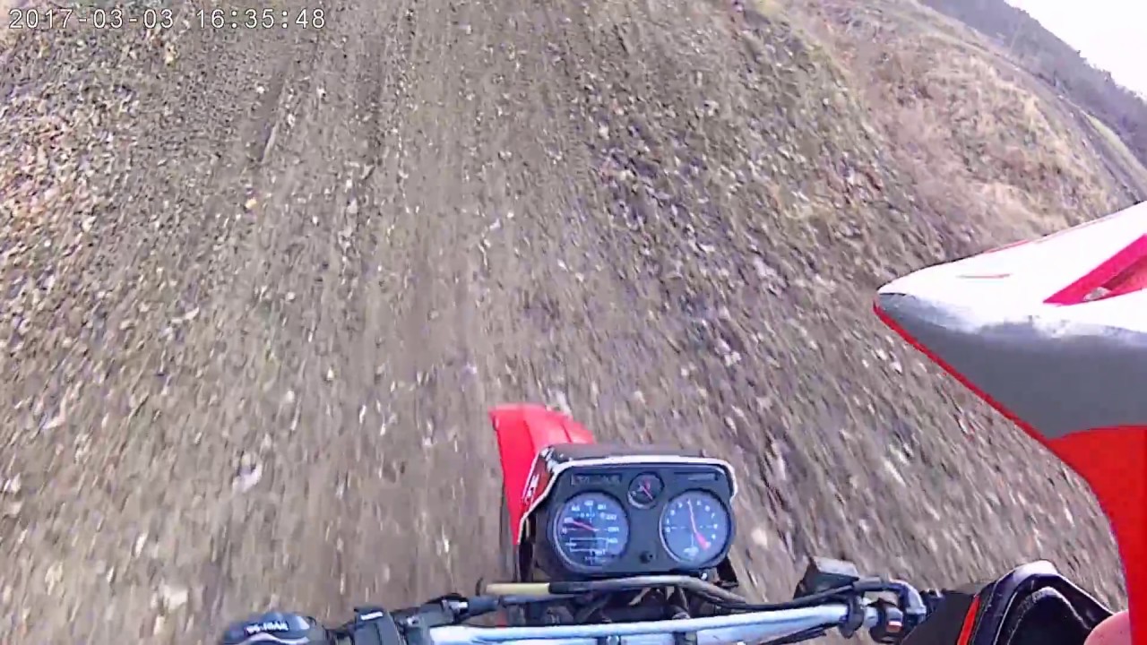 Honda mtx 125 riding a motocross track