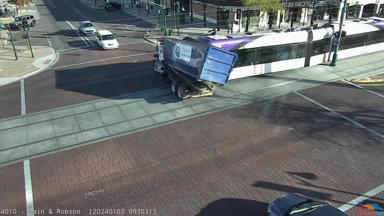 Valley light rail runs red light before crashing into garbage truck in Mesa