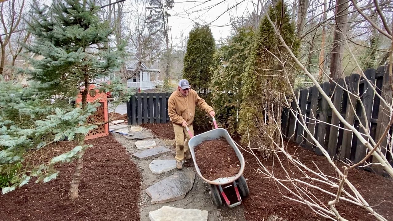 Finishing a 10 yard mulch and flagstone walkway project!