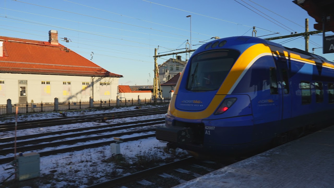 Sweden, Sundsvall, arriving by train, 2X escalator, 1X Level Crossing