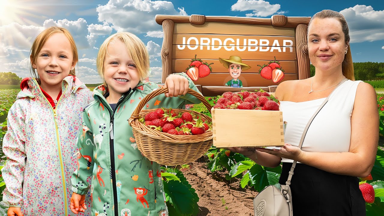 PLOCKAR JORDGUBBAR MED BARNEN