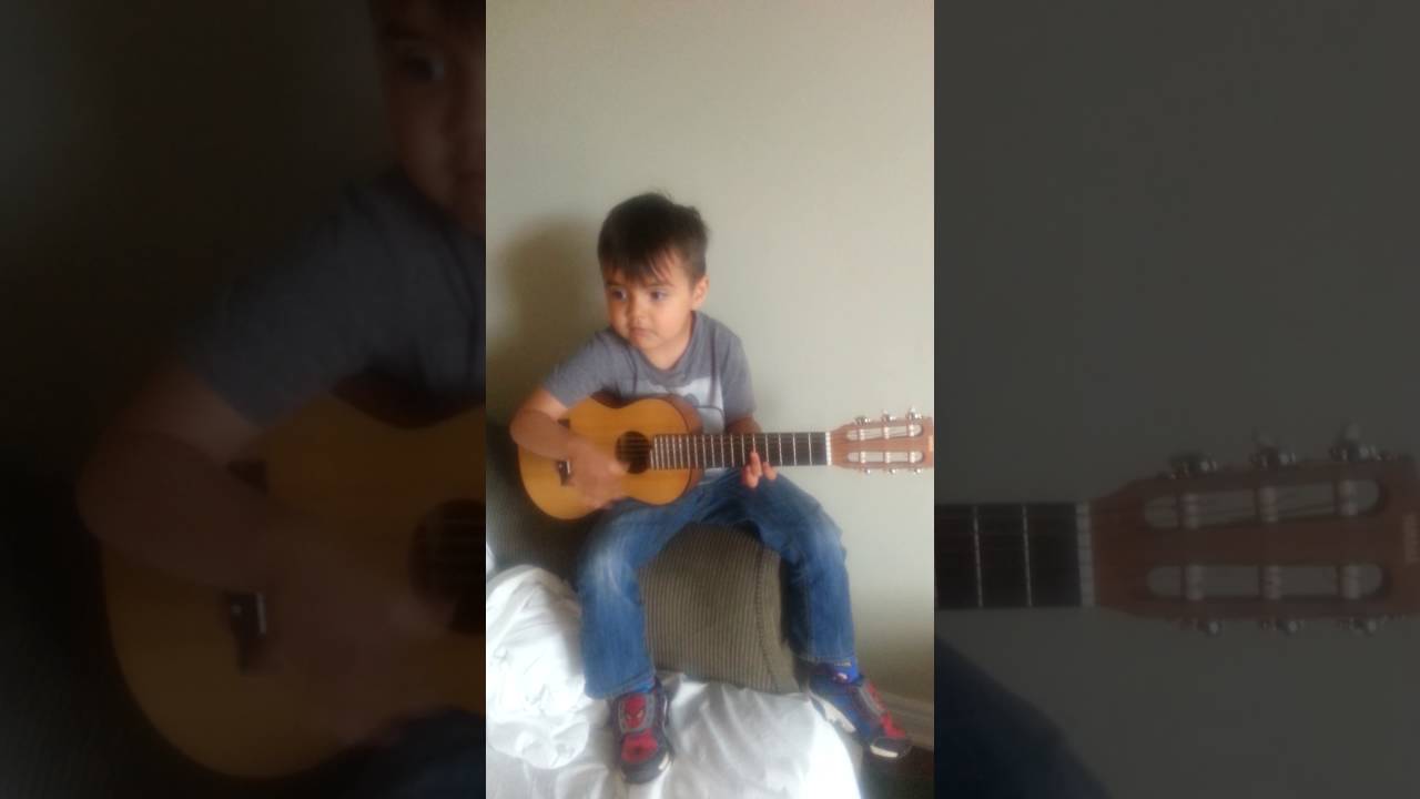 4 year old plays guitar