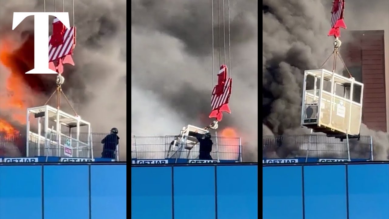 Workman lifted to safety from burning building in Reading