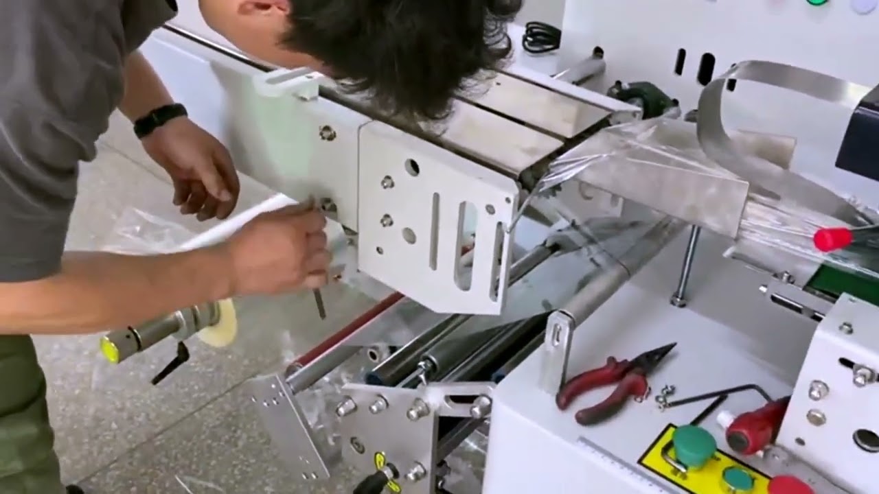 Tutorial demo how to install flow wrap pillow pack equipment