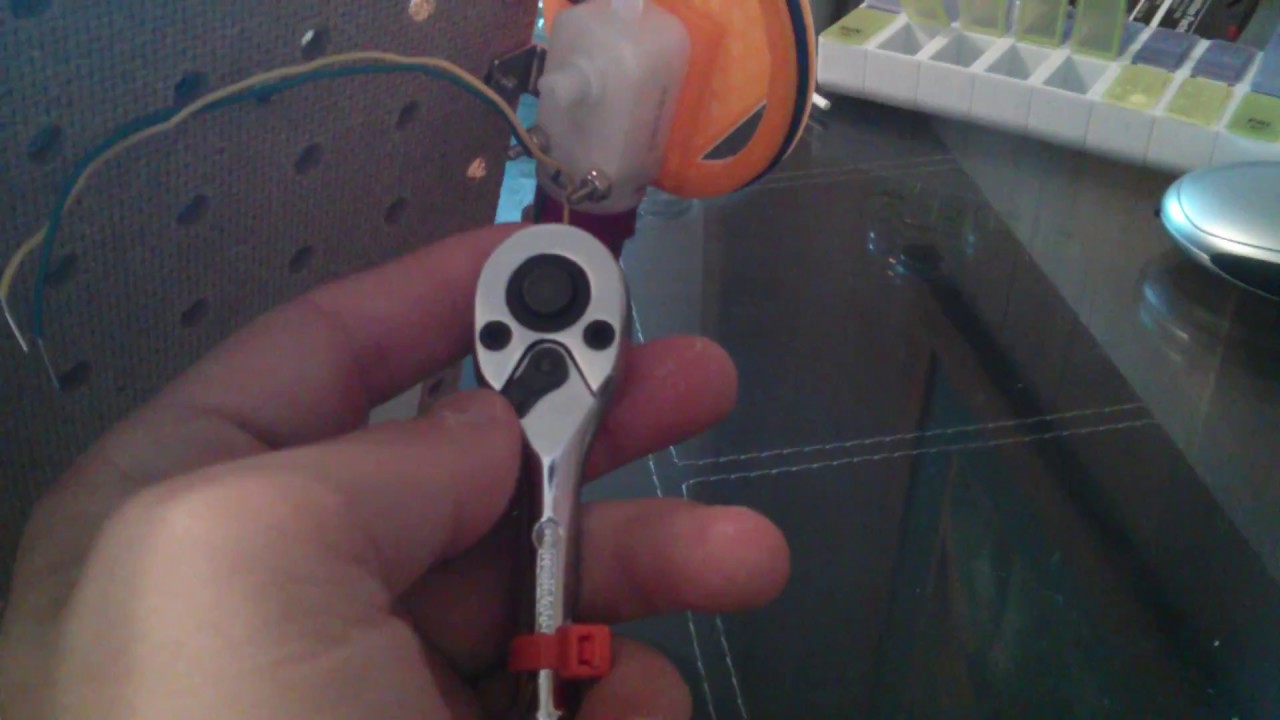 tightening and loosening nuts with socket wrench