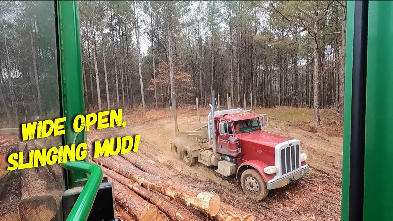 Log trucks + MUD= Caterpillars PURRING!
