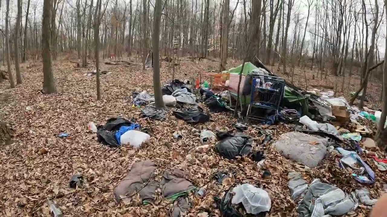 Camp trash in woods behind Home Depot Fairless Hills