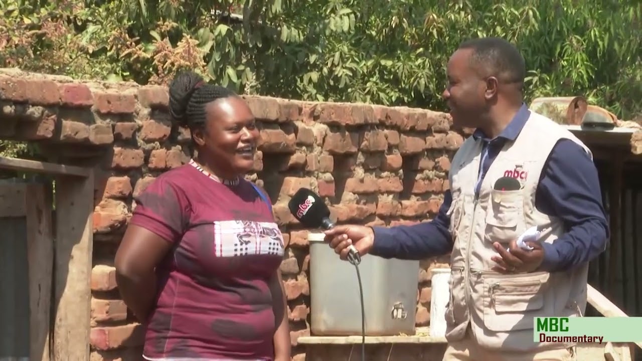 KUSINTHA MAGANIZO WITH REVEREND PROFESSOR EMMANUEL MLENGA AND HIS WIFE NINA MLENGA