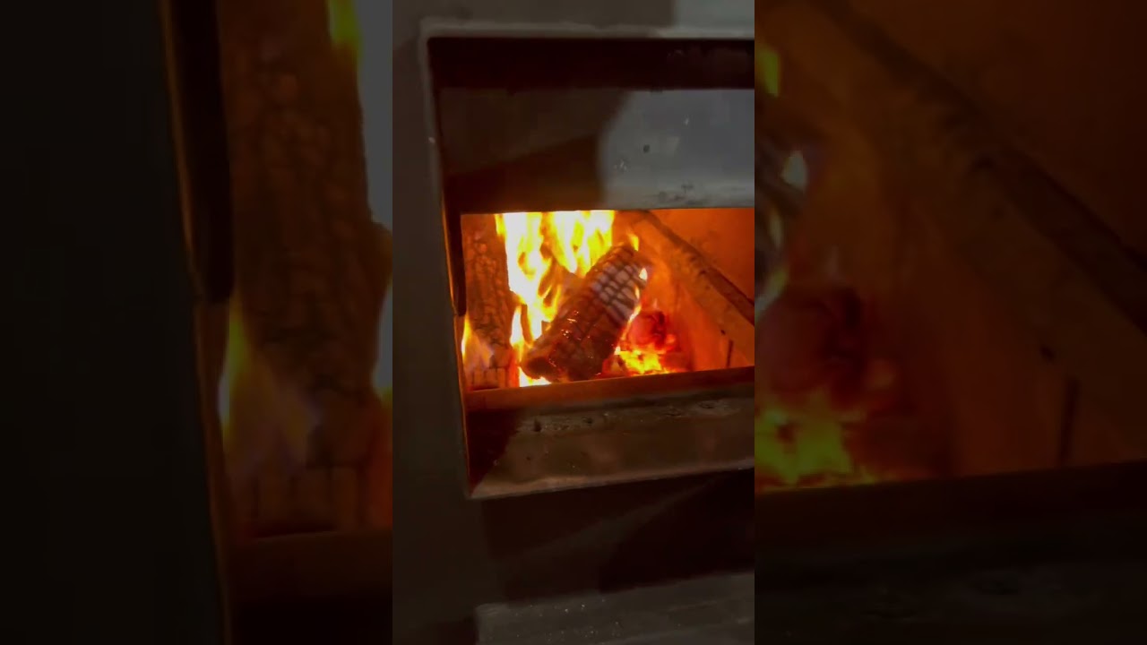 Loading firewood in basement for wood burning furnace