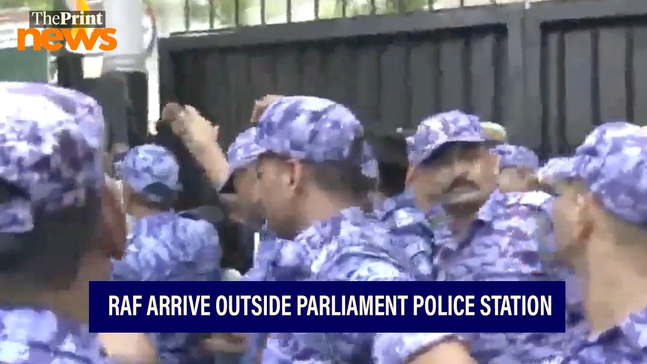RAF personnel arrive outside the Parliament street police station