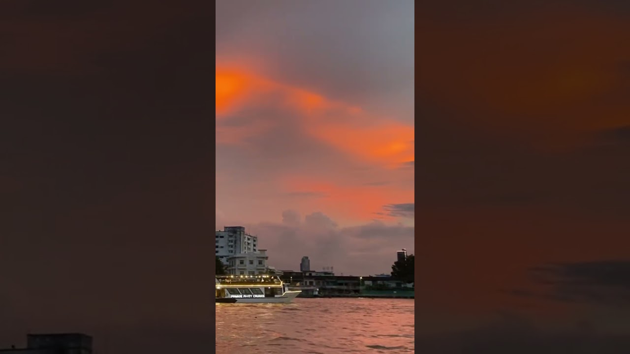 Bangkok - Beautiful orange sunset over the Chao Phraya in Bangkok