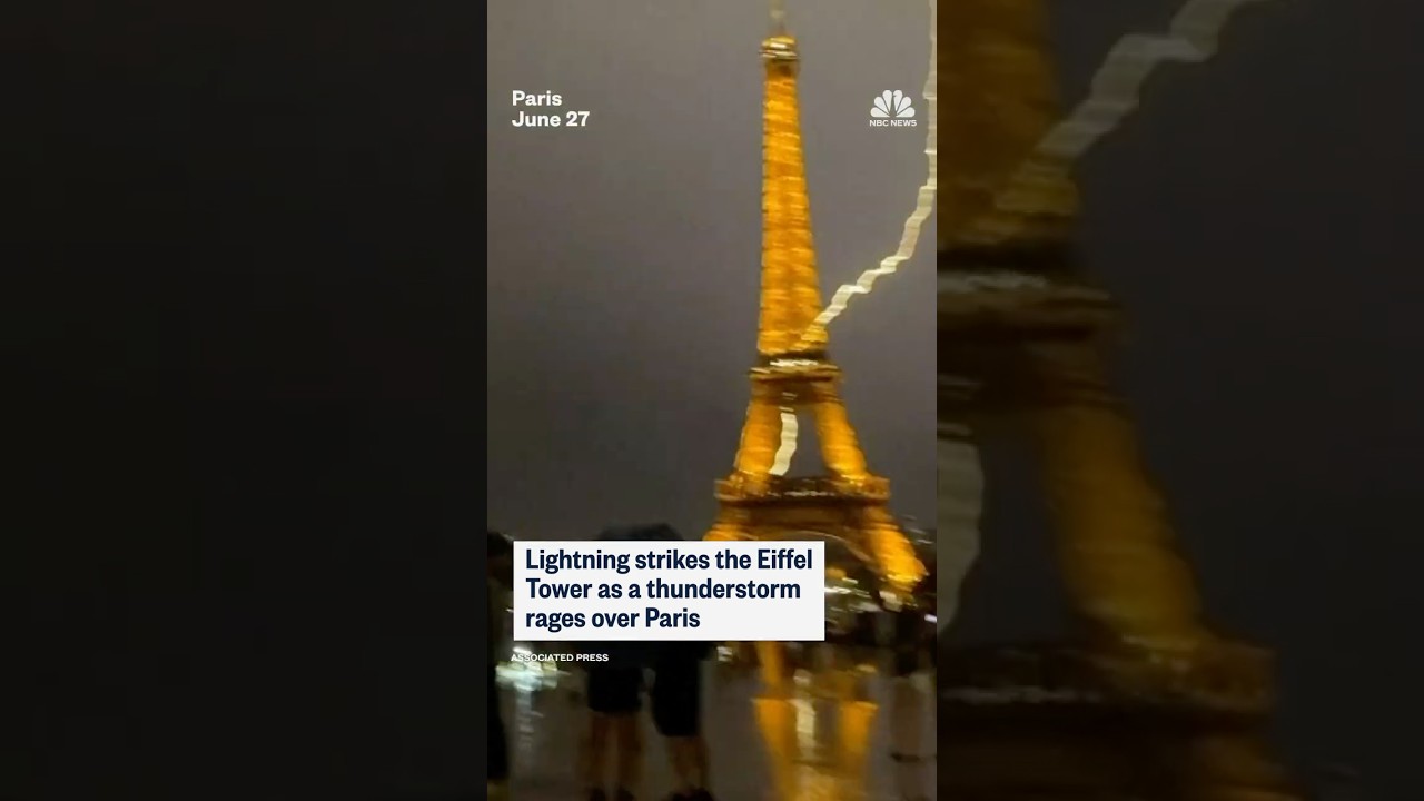 Lightning strikes the Eiffel Tower as a thunderstorm rages over Paris