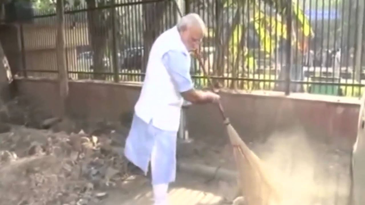 PM Narendra Modi sweeps Roads with Broom in Clean India campaign
