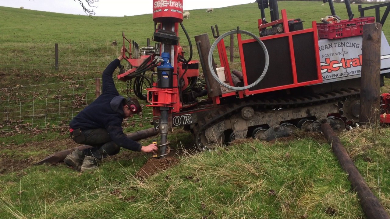 SoloTrak track mounted post driver with Auger