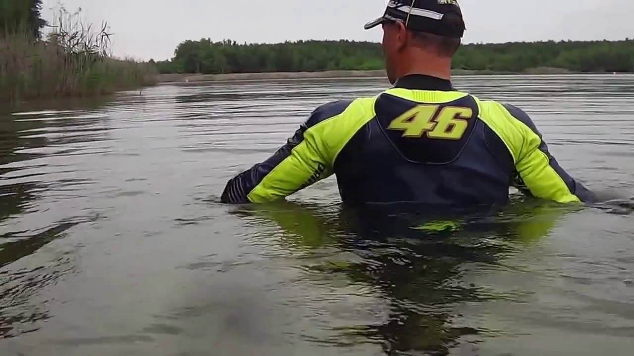 swimming with vr46 valentino rossi bikesuit in a lake part 1