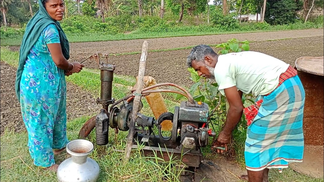 Village farmer Shelo machine start with his wife.গ্রামের মানুষ কিভাবে মিলেমিশে কাজ করে দেখুন।
