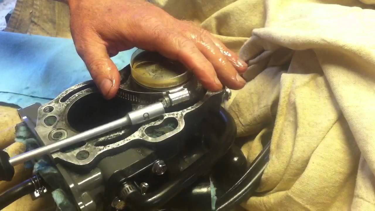 Piston ring insertion using hose clamp and plastic