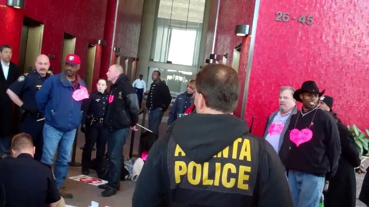 Police Arrest 12 Protesters at AT&T