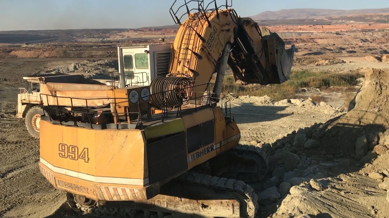 Liebherr 994 Front Shovel Excavator Loading Terex TR100 Dumpers