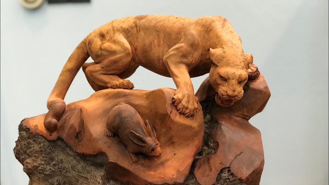 Carvings leopard hunt rabbits | TUAN WOOD CARVINGS