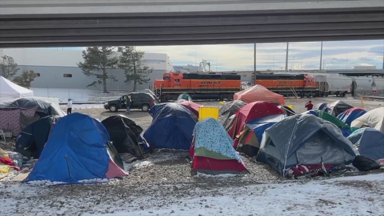 Denver to slash city budget to fund migrant aid