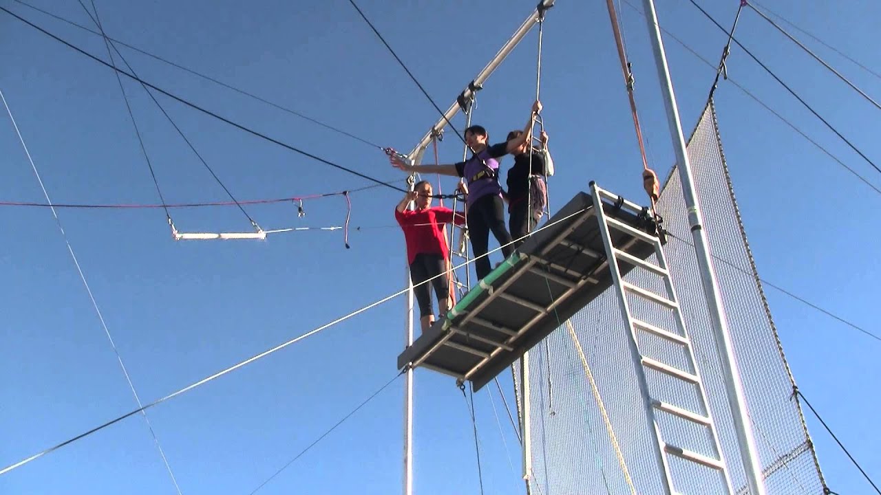 Sandy trying her hand at the flying trapeze
