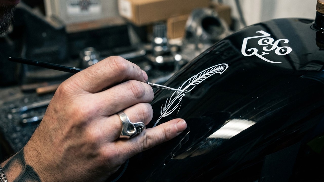 Painting Led Zeppelin symobls on a chopper petrol tank