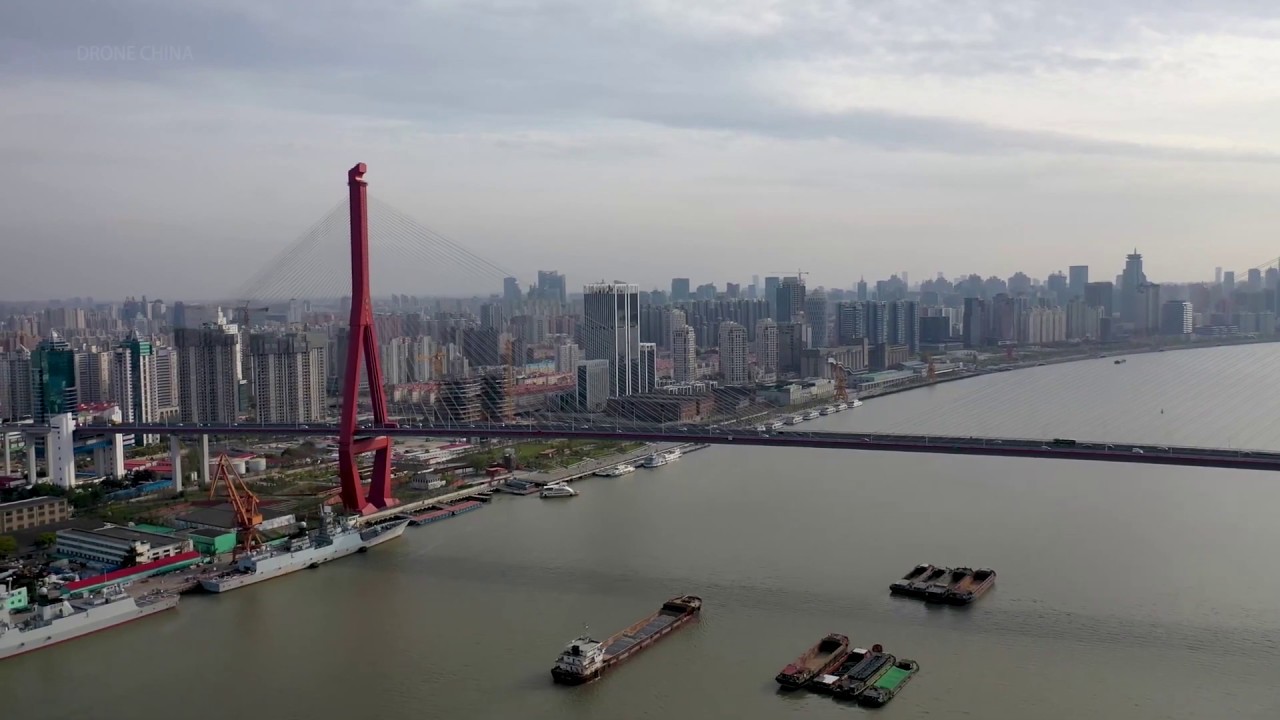 SHANGHAI,Yangpu District, Aerial shot over Huangpu River with Yangpu Bridge and Shanghai skyline