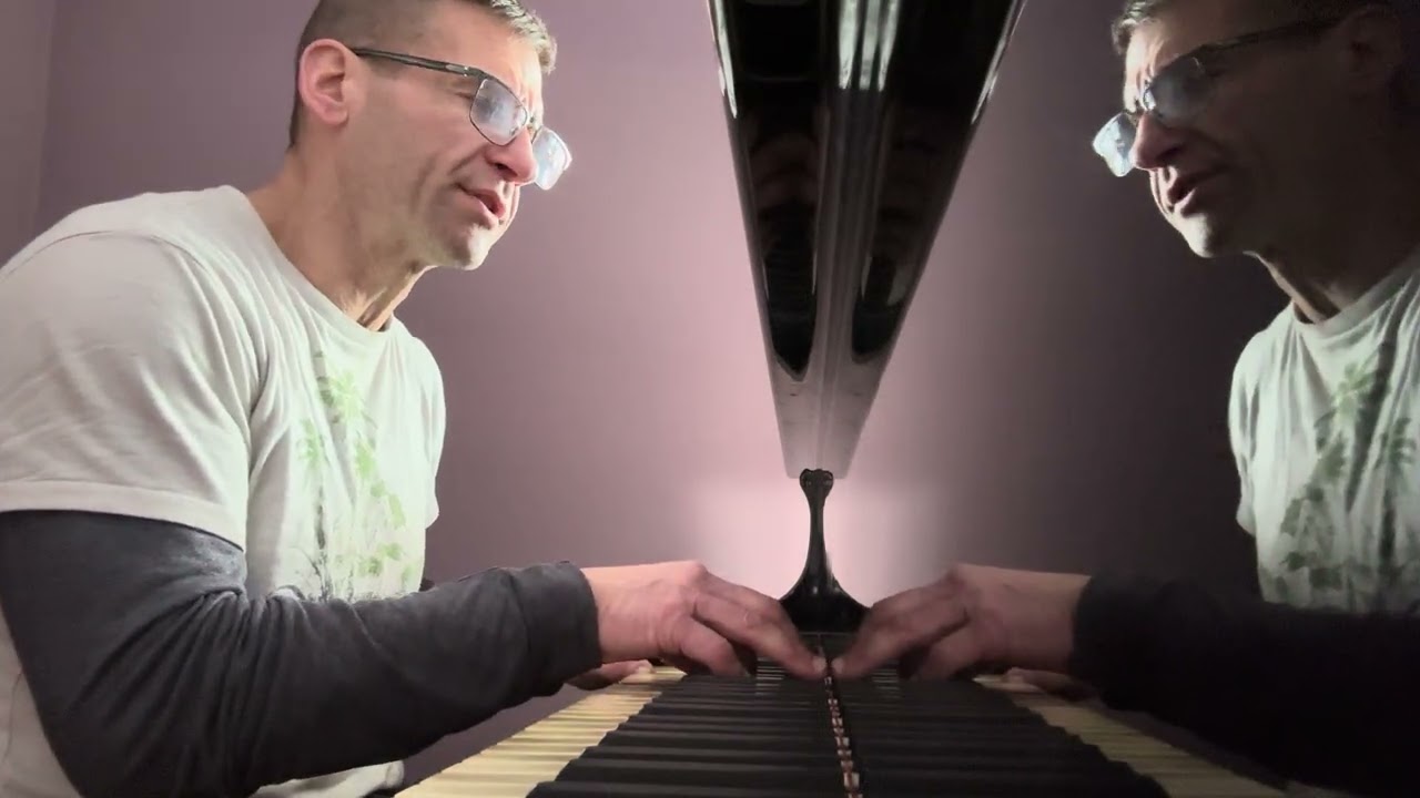 Practicing piano Billy Joel songs