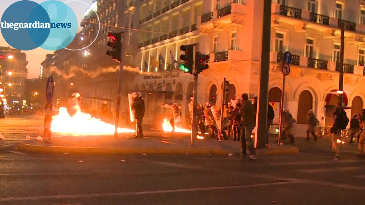 Greek anti-austerity protesters throw petrol bombs at police
