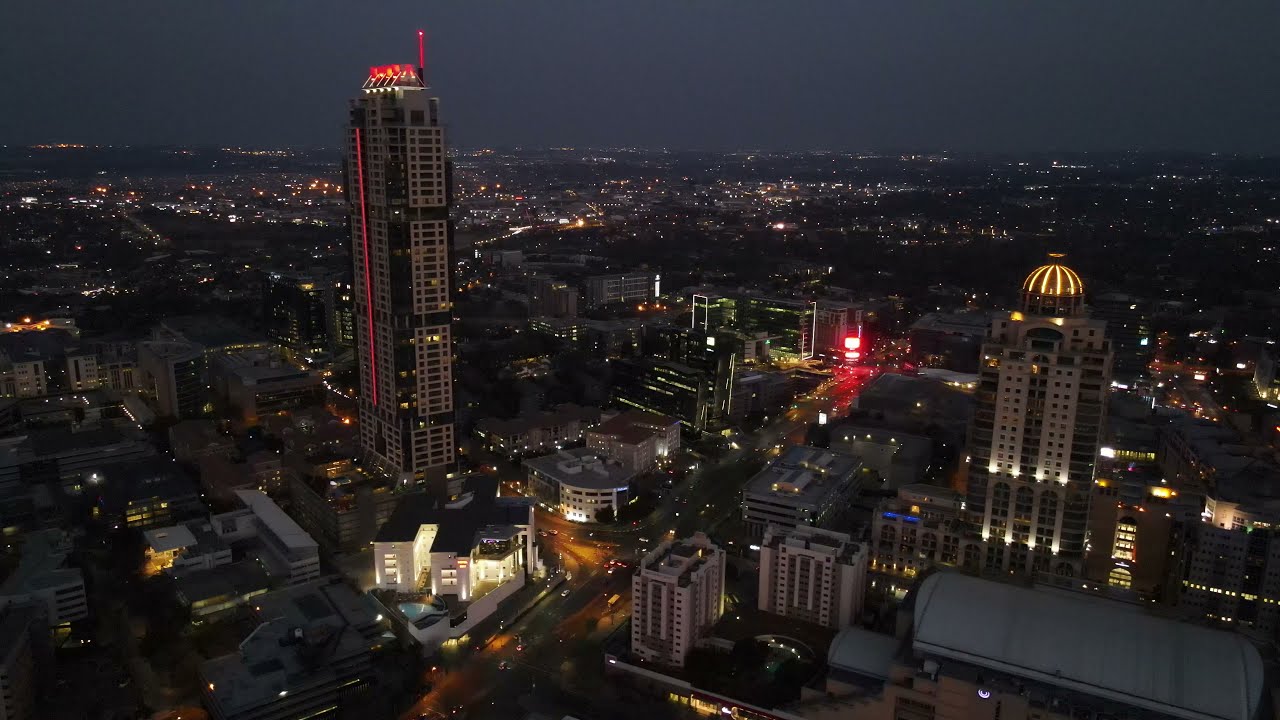 Night flight over Sandton City in 4K.