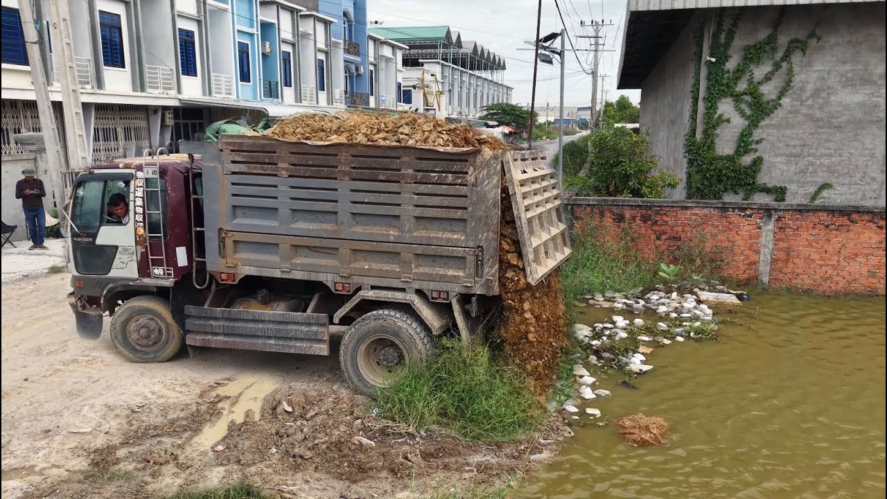 Perfectly Started New Project!Dump Truck Loading Soil Delete Pond By Skillful Doz&eacute;r D31 Pushing Soil