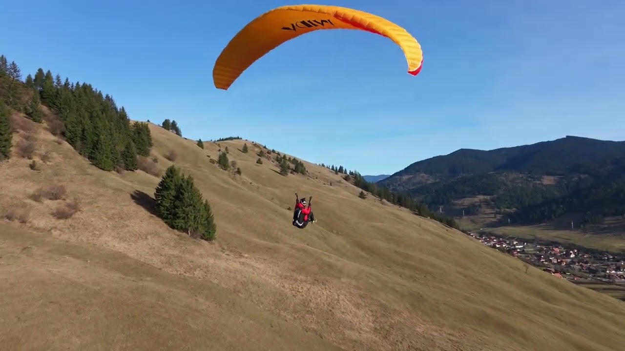 DJI Neo 2 drone  following paraglider