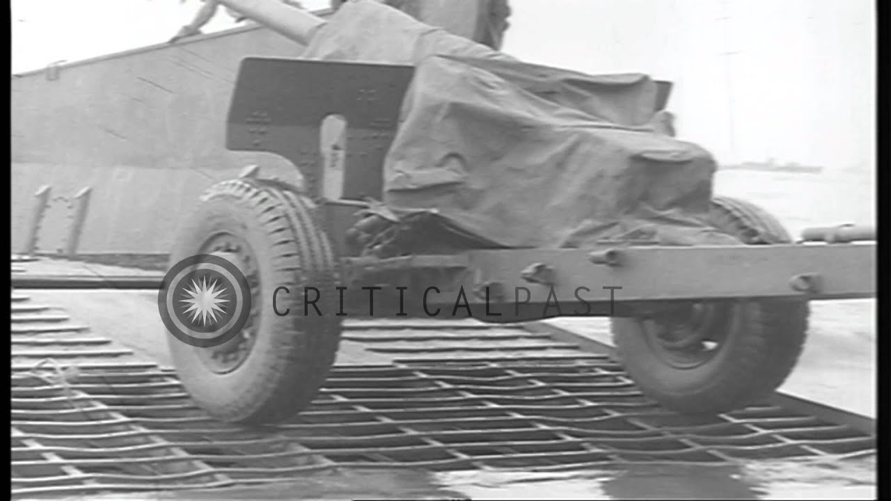 US 40th Division soldiers unload antiaircraft gun, food supplies and half-track a...HD Stock Footage