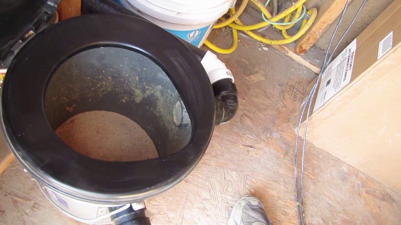 Outhouse sawdust toilet with a passive solar air circulation