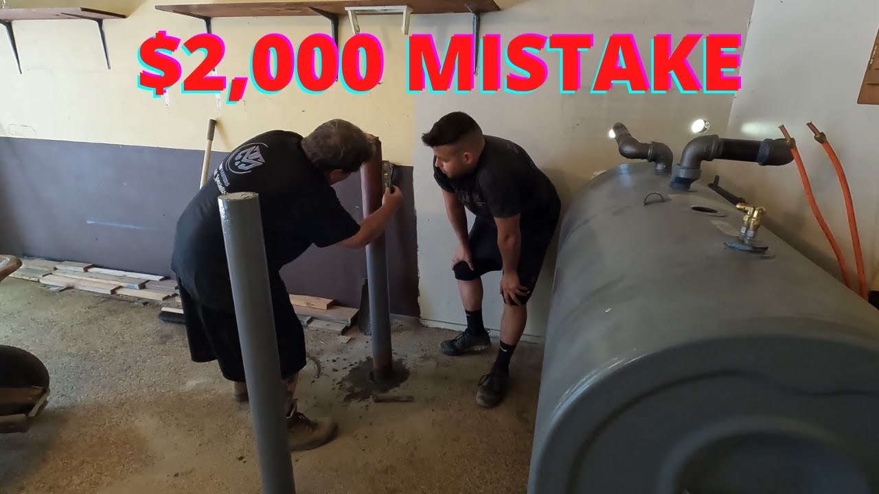 Переустановка надземного масляного резервуара в гараже с защитными столбиками