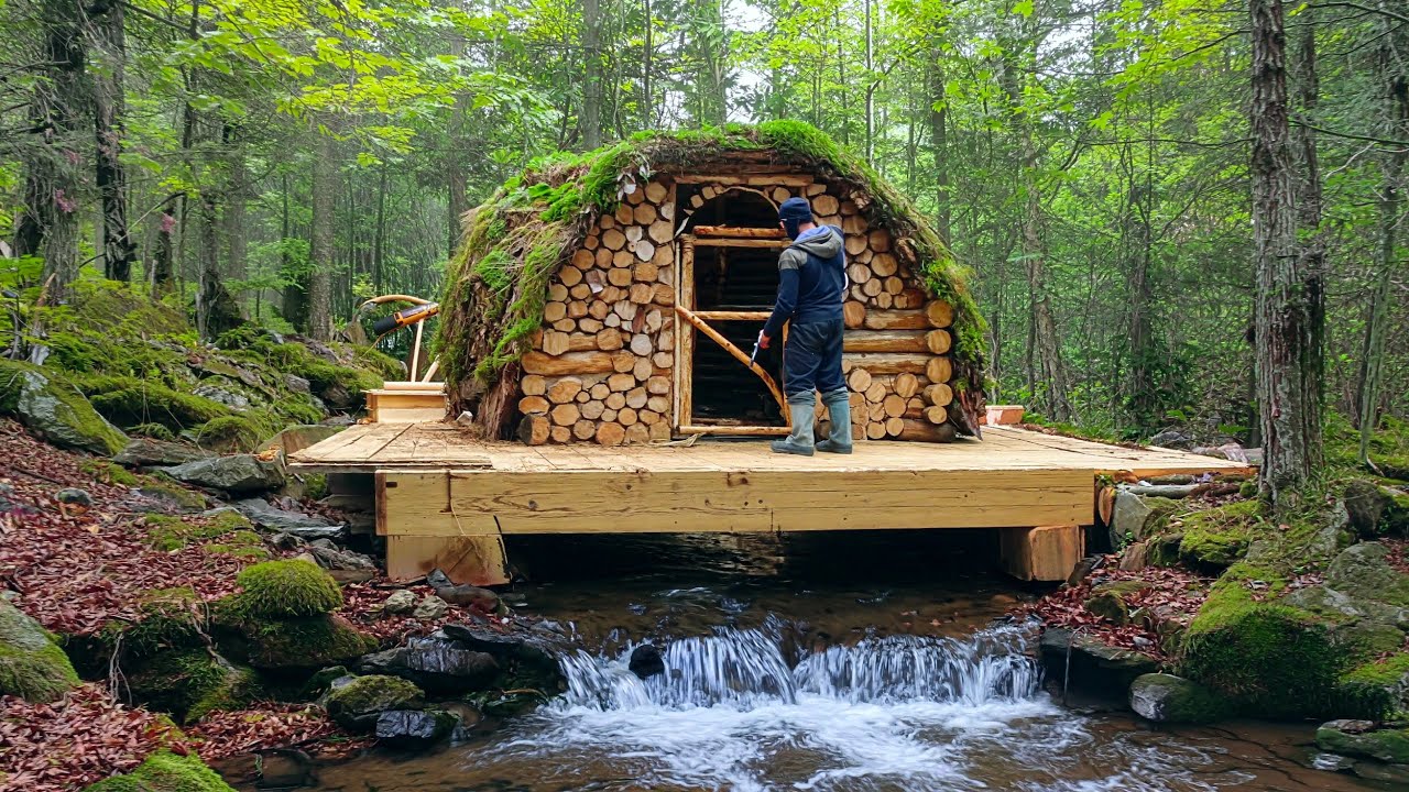 A Man Builds a Secret Shelter in the Forest Above the Stream