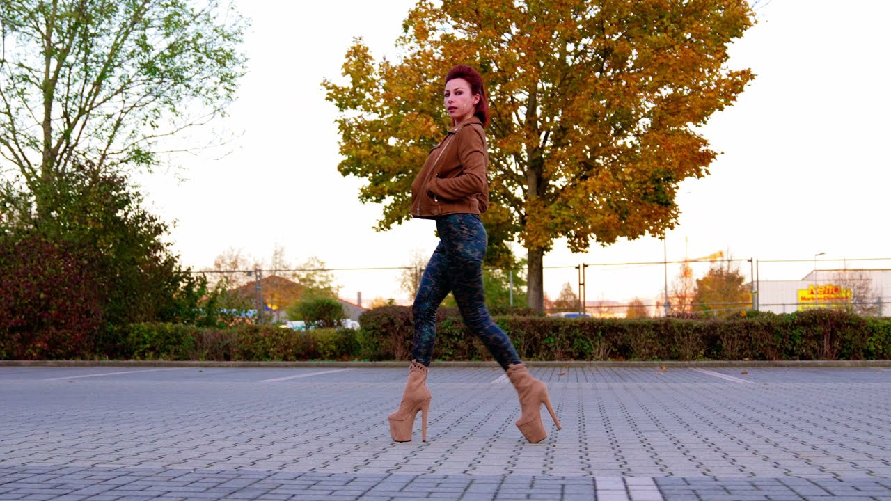 Confident walk in publick, wearing spandex leggings and 9 inch Hella Heels.