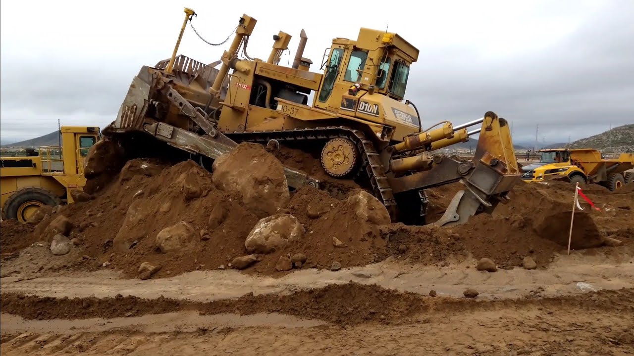 CAT D10N Dozer pushing dirt and rock - amazing power
