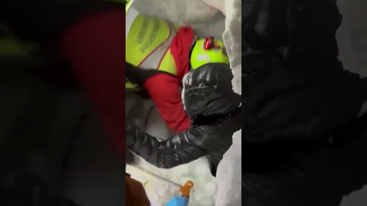 Italian Alpine rescuers dig hiker from snow after avalanche