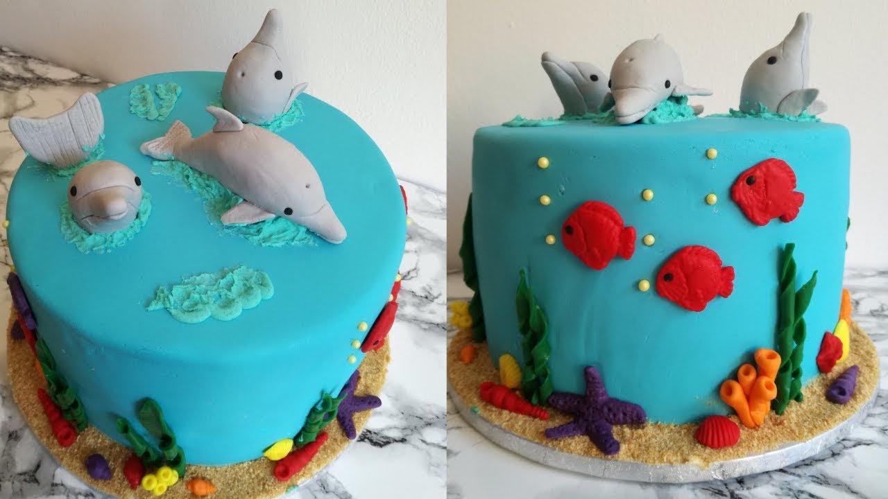 Sea themed cake with dolphin toppers|Birthday cake idea