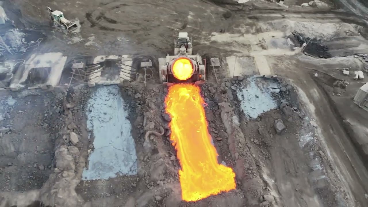 Steel mill dump truck dumping slag P1.