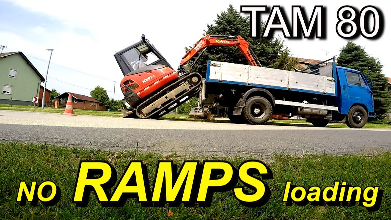 Utovar bagera bez rampi na kamion TAM 80