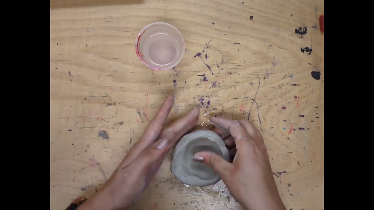 Clay face pinch pot