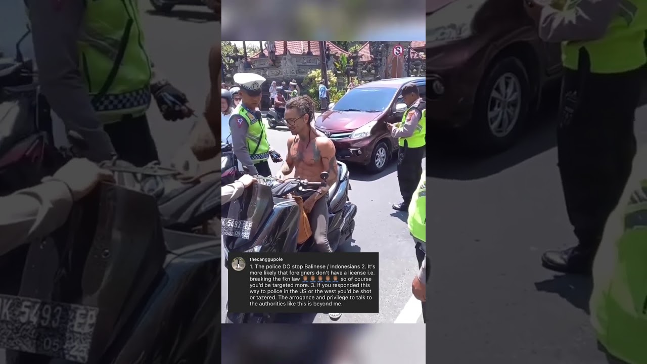 Police stop a foreign scooter rider without a helmet in Ubud Bali